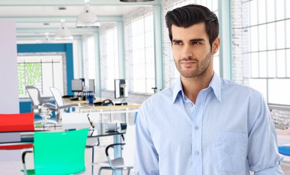 Casual man in modern colorful office