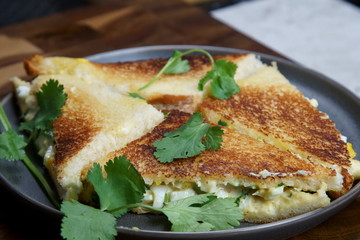 A palte of Bread and egg salad with mayonaise sandwich on a plate with copy space.