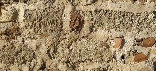 Vintage turkish brick wall. The restored wall of the Turkic conquerors. Warm brown-red shades of...