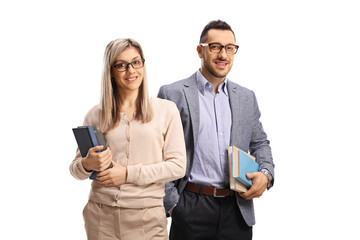 Young man and woman holding books
