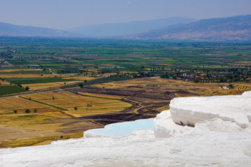 The beautiful pools of Pamukkale in Turkey. Pamukkale contains hot springs and travertines,...