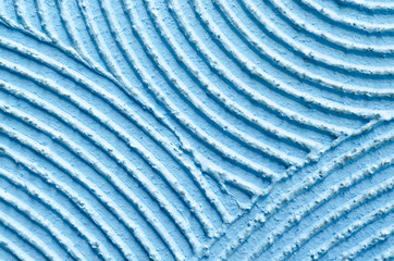 Texture of rough decorative rough blue putty. semicircles bends monochrome abstract seamless  background. copy space, mock up