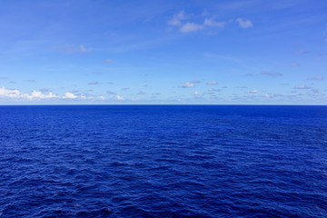 sea and blue sky with few clouds