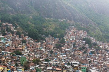 Fototapeta na wymiar Rocinha favela, also known as a slum or shanty town, built on a steep hillside in the South Zone of Rio Di Janeiro, Brazil, South America