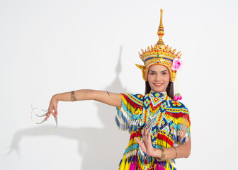 Obraz premium Young lady wearing Thai Tradition southern costume and put headdress on her head,showing basic pattern folk dance,black shadow reflection on white background