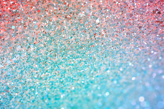 Sparkling red and turquoise background, abstract glitter and sequins paper
