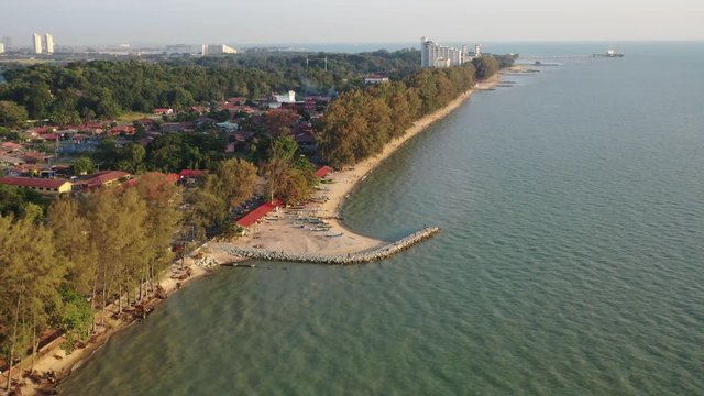 4k cinematic b-roll drone shot of flying above Pantai Puteri, famous beach at Melaka, Malaysia. 