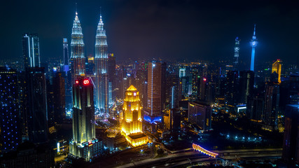 Kuala Lumpur, Malaysia - December 28, 2019 : KL Tower and Petronas Twin Towers. Famous landmark of Kuala Lumpur at night. Kuala Lumpur city skyline.