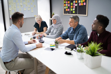 Man Sitting At Interview
