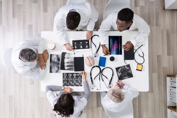 Doctors Looking At X-ray Images