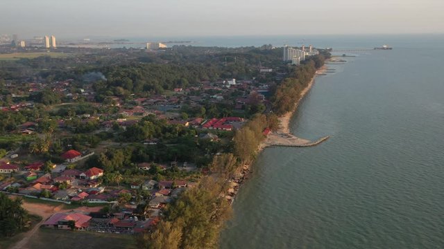 4k cinematic b-roll drone shot of flying above Pantai Puteri, famous beach at Melaka, Malaysia. 