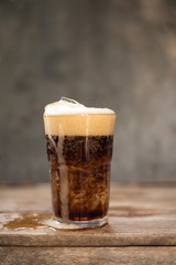 Ice cubes with soft drink.