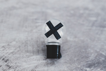 decision making,  bad idea rejected and crossed out shot at shallow depth of field edited with desaturated tones and minimalist look