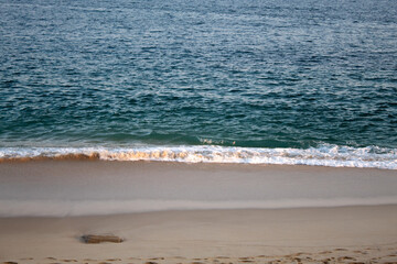 sunny beach and the clear ocean