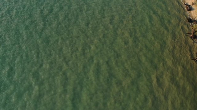 4k cinematic b-roll drone shot of flying above Pantai Puteri, famous beach at Melaka, Malaysia. 