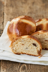 Easter cross buns on old wooden background