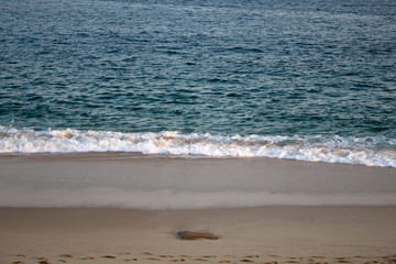 sunny beach and the clear ocean
