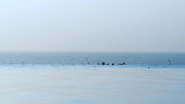 View of tropical beach from infinty pool