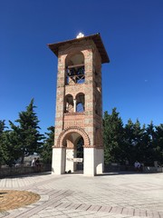 Fototapeta na wymiar Bosnia. Trebinje. The temple on mount Hercegovacka Gracanica. Bell tower.
