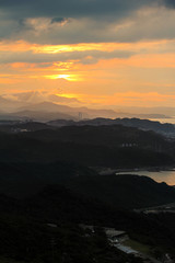 Plakat Evening sunset twilight and sun flare view at mountain slope with island sea and cloudy sky background landscape
