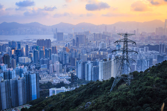 Power tower on a hill with Hong Kong city as background at sunset time - Powered by Adobe