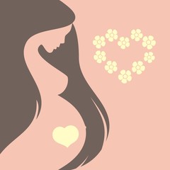 Silhouette of a young pregnant woman