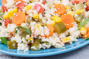 Fresh salad with couscous and vegetables. Best nutritious food for dieting and slimming. Source...