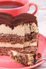 Tasty creamy tiramisu cake and black coffee for different occasions. Delicious dessert