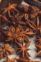 Dried anise stars on the rustic background. Selective focus. Shallow depth of field.