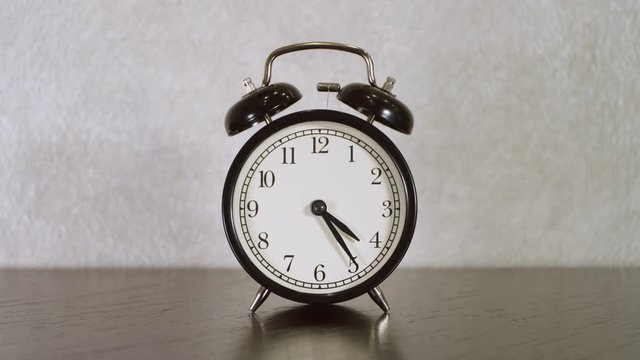 Vintage alarm clock ringing at 5-00 o&rsquo;clock. Two shots editing.