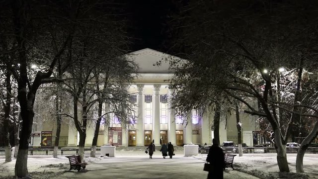 pedestrians cars architecture monuments in the evening winter city in Russia