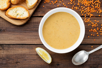 Red lentil soup served with lemon and toasted bread.