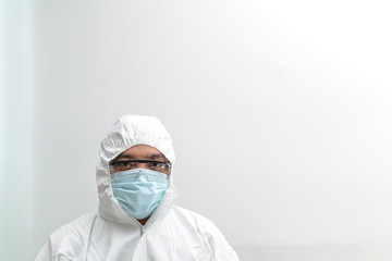 Fototapeta na wymiar Asian male doctor wearing protective suits prepare before entering the quarantine area to develop a new vaccine against coronavirus. New testing for coronavirus emerges.
