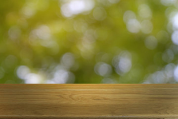 Empty dark wooden table in front of abstract blurred bokeh background of restaurant . can be used for display or montage your products.Mock up for space.