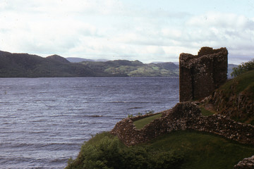 Fototapeta na wymiar Ruins of an ancient fortress on the banks of Loch ness High Land. Scotland. Great Britain. Photo on 35 mm film.