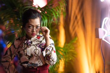 beautiful asian woman with neon light background