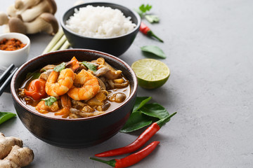 Tom Yum Goong or Tom Yum Kung spicy Thai soup and ingredients.