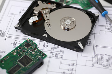 Hard drive from computer or laptop lies on the table in the repair shop. Performs fault diagnostics...