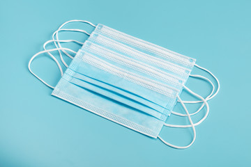 Medical mask on blue background.