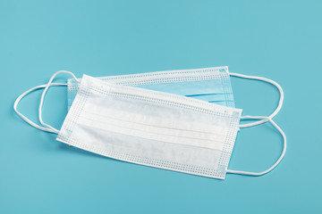 Medical mask on blue background.