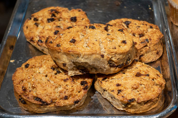 fresh Raisin Biscuits on a steel tray at the market