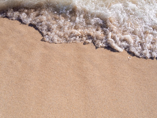 Sea wave and sand beach at Waikiki beach in Honolulu, Oahu Island, Hawaii.