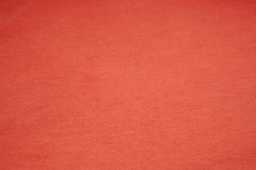 Red color surface cotton fabric  - Waving backdrops texture background of clothing 