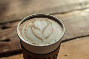 cup of coffee on wooden table