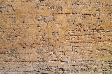 Ruff distressed weathered red orange.masonry cement surface