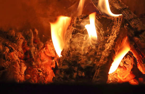 Burning coals in the fireplace.
