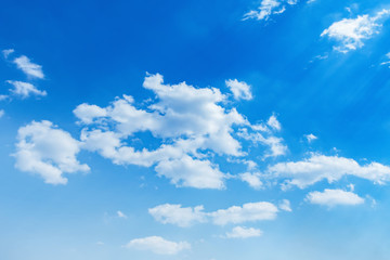 Naklejka na ściany i meble beuatiful blue sky with white cloud and sunshine background