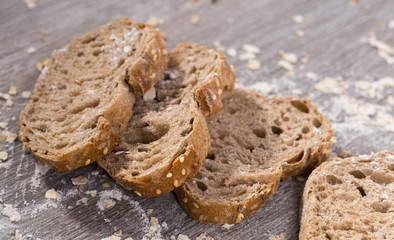 fresh slices of rye bread on wooden surface
