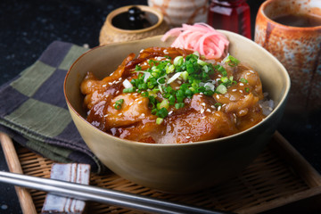 Rice with fried pork and kimchi sauce.