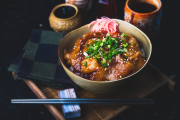 Rice with fried pork and kimchi sauce.